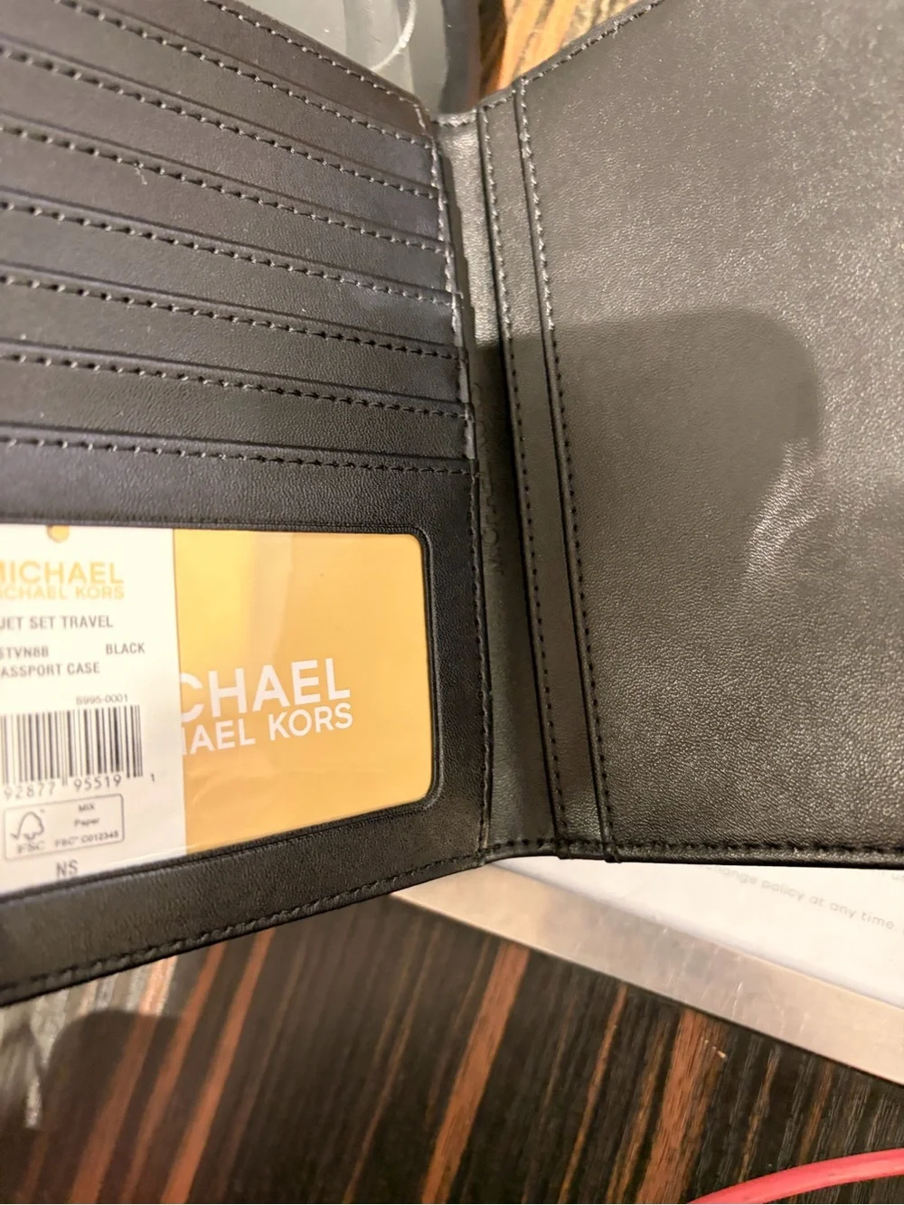 Michael Kors Black Signature MK Passport Wallet with Silver Logo